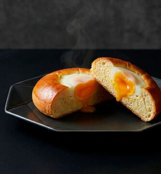 Gyeran-ppang is a classic Korean egg bread, baked soft and warm, presented in a refined modern editorial food style.