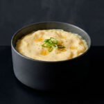 Gyeran-jjim is a classic Korean steamed egg dish known for its silky texture and comforting warmth, presented in a refined editorial style.
