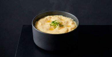 Gyeran-jjim is a classic Korean steamed egg dish known for its silky texture and comforting warmth, presented in a refined editorial style.